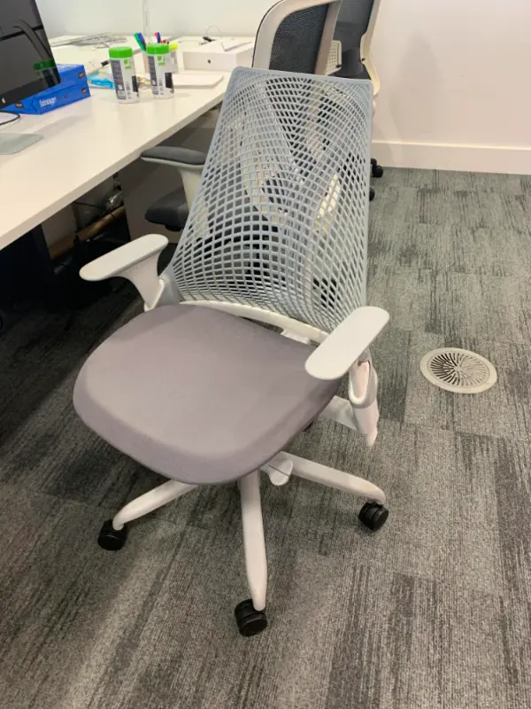 White and Grey Office Chair with spiral back board