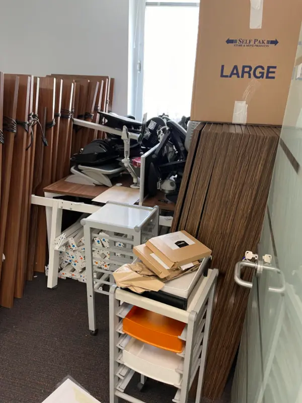 Office furniture collated and ready to be cleared